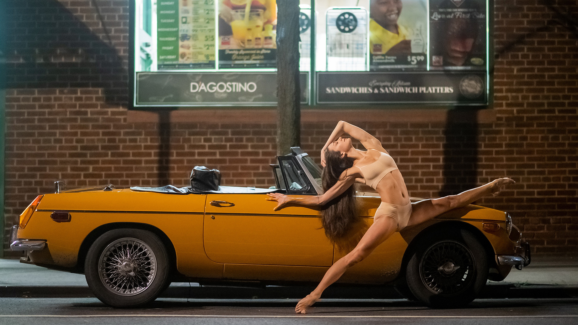 Convertible car and ballerina dancer